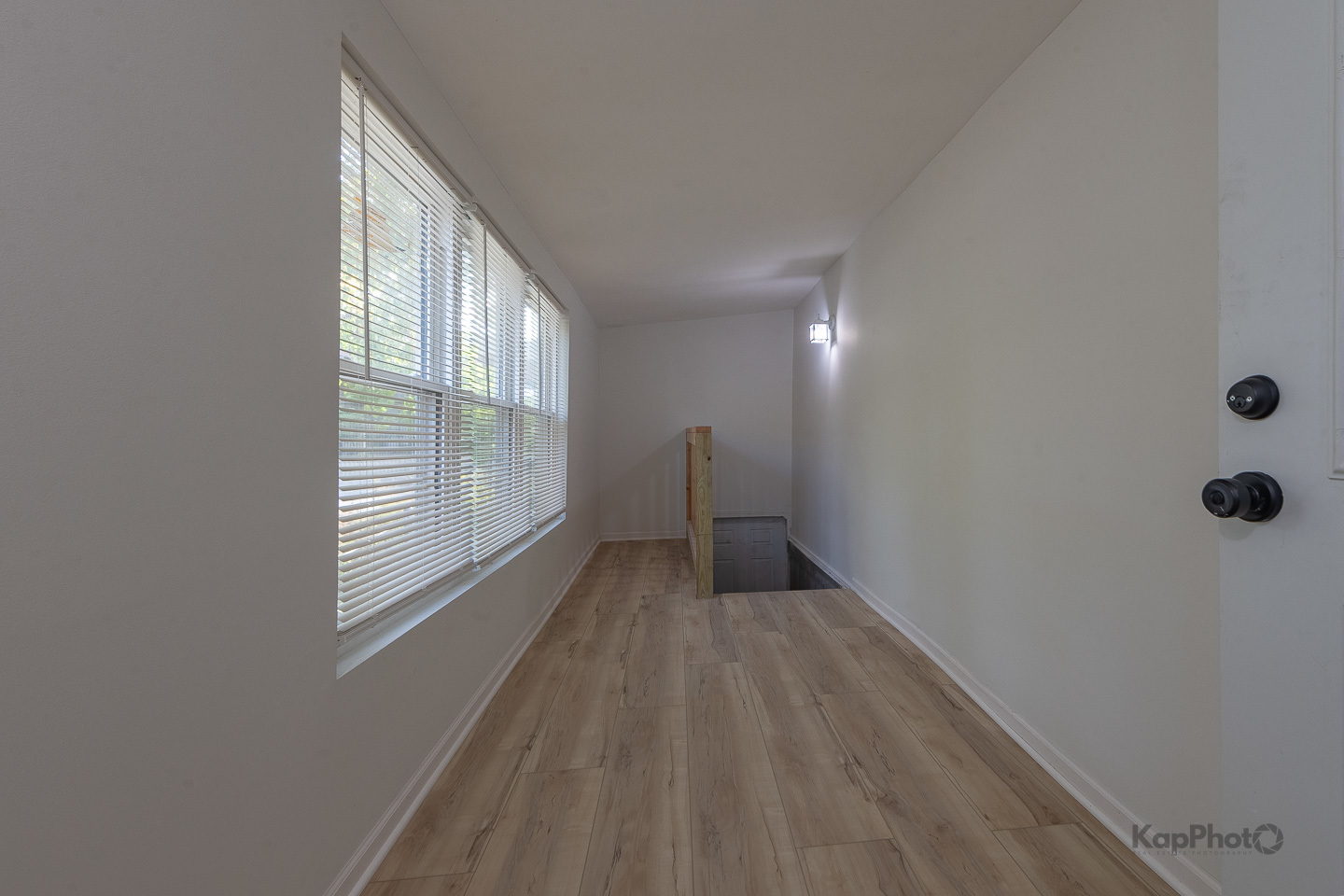 2029 South Canalport Avenue, Unit 2 Chicago, IL 60616 - Photo 11 of 28 a view of an empty room with wooden floor and a window