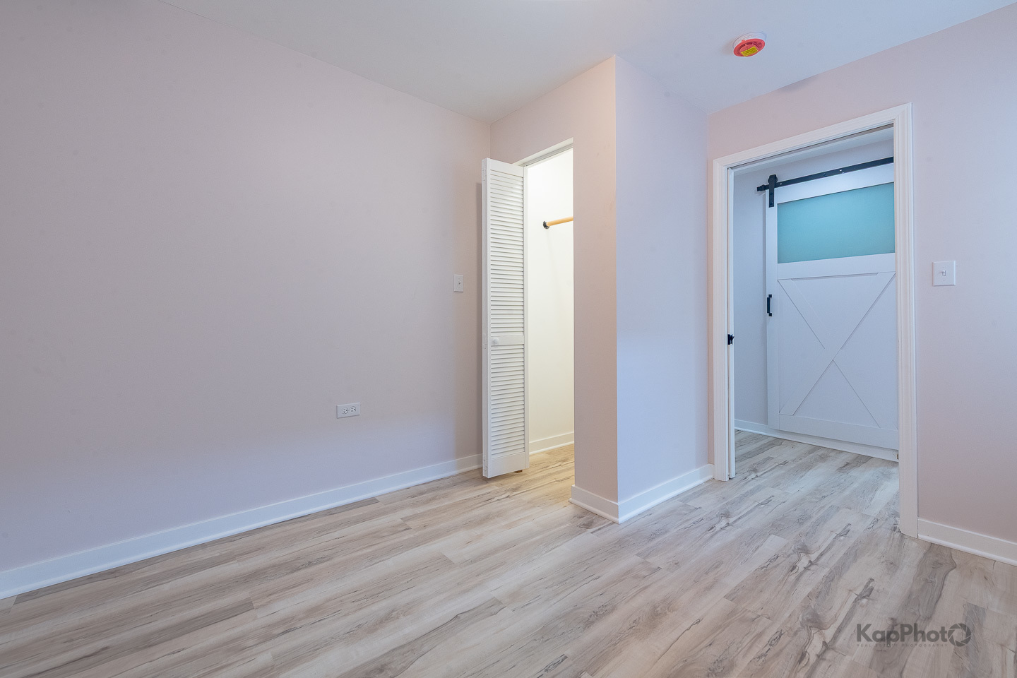 2029 South Canalport Avenue, Unit 2 Chicago, IL 60616 - Photo 16 of 28 an empty room with wooden floor and closet