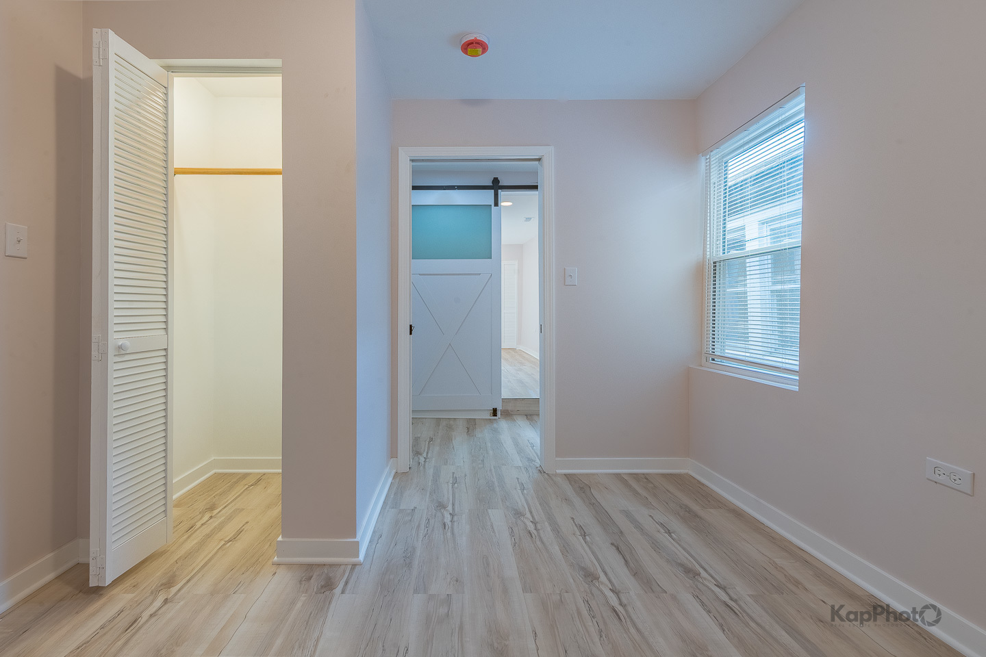 2029 South Canalport Avenue, Unit 2 Chicago, IL 60616 - Photo 17 of 28 a view of room with window and wooden floor