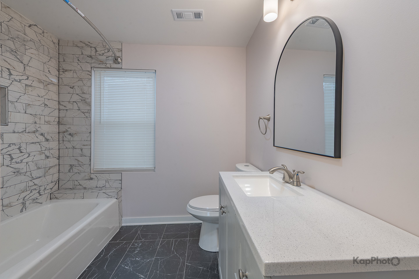 2029 South Canalport Avenue, Unit 2 Chicago, IL 60616 - Photo 23 of 28 a bathroom with a sink and a mirror