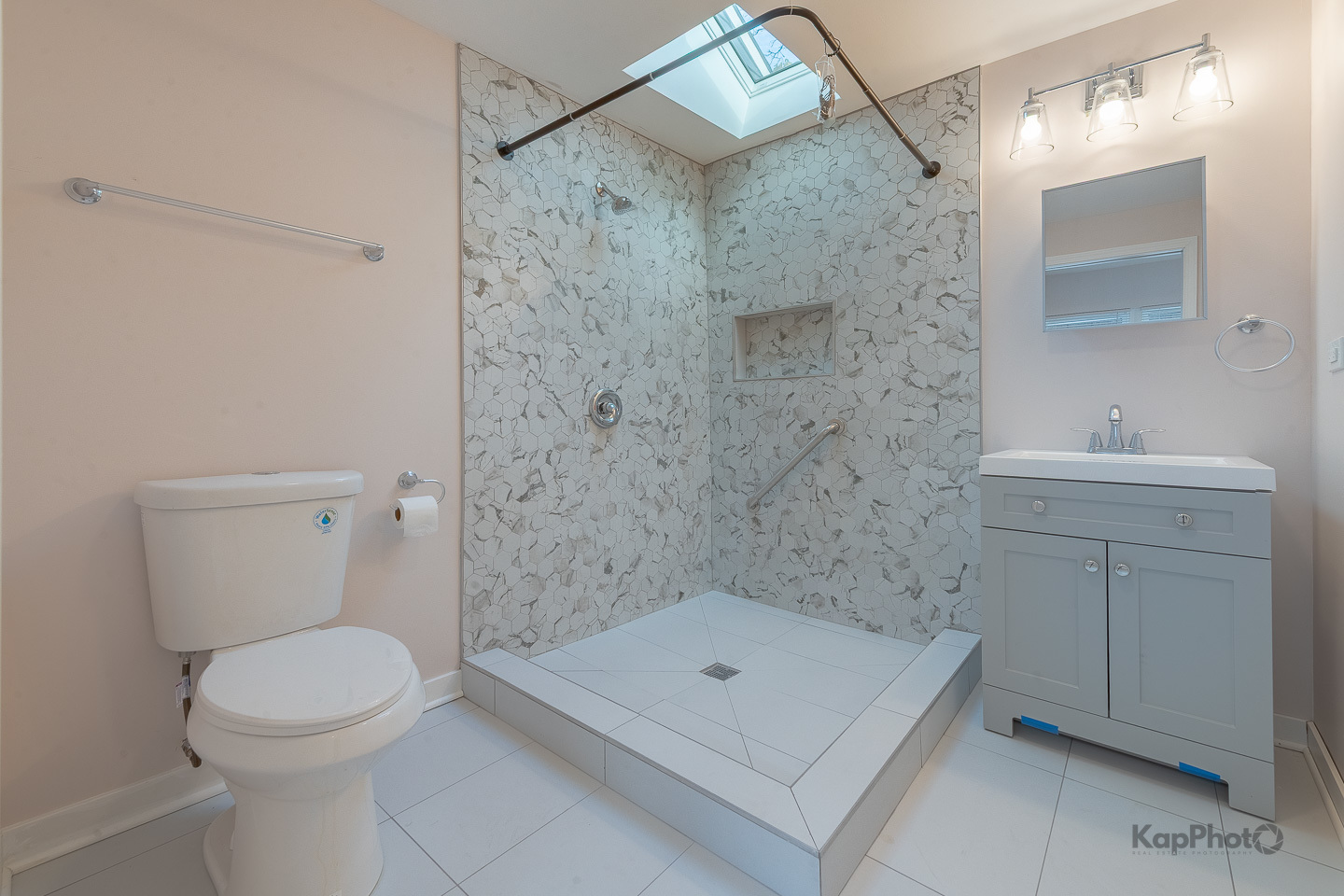 2029 South Canalport Avenue, Unit 2 Chicago, IL 60616 - Photo 25 of 28 a bathroom with a sink a toilet and shower