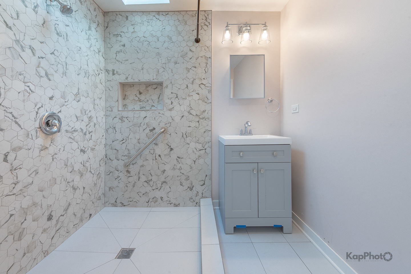 2029 South Canalport Avenue, Unit 2 Chicago, IL 60616 - Photo 26 of 28 a bathroom with a sink and a mirror