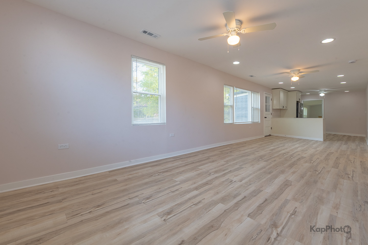 2029 South Canalport Avenue, Unit 2 Chicago, IL 60616 - Photo 3 of 28 a view of an empty room with window and wooden floor
