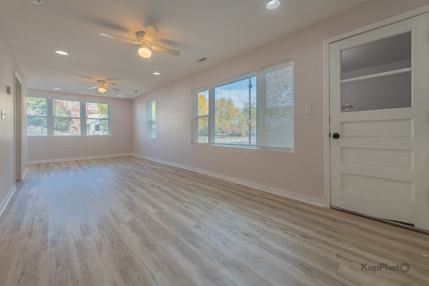 2029 South Canalport Avenue, Unit 2 Chicago, IL 60616 - Photo 4 of 28 an empty room with wooden floor and windows