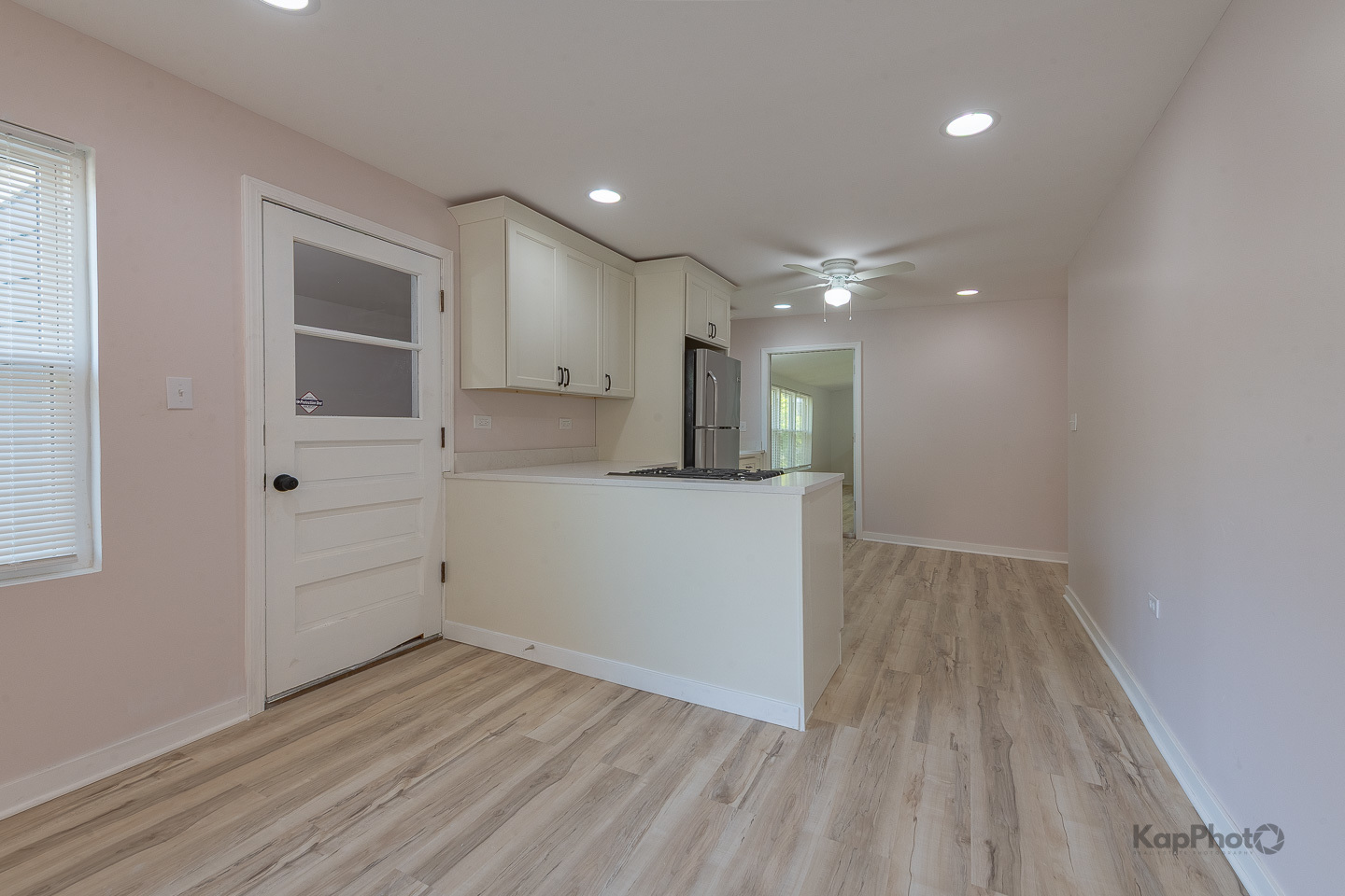 2029 South Canalport Avenue, Unit 2 Chicago, IL 60616 - Photo 5 of 28 wooden floor in an empty room with a kitchen