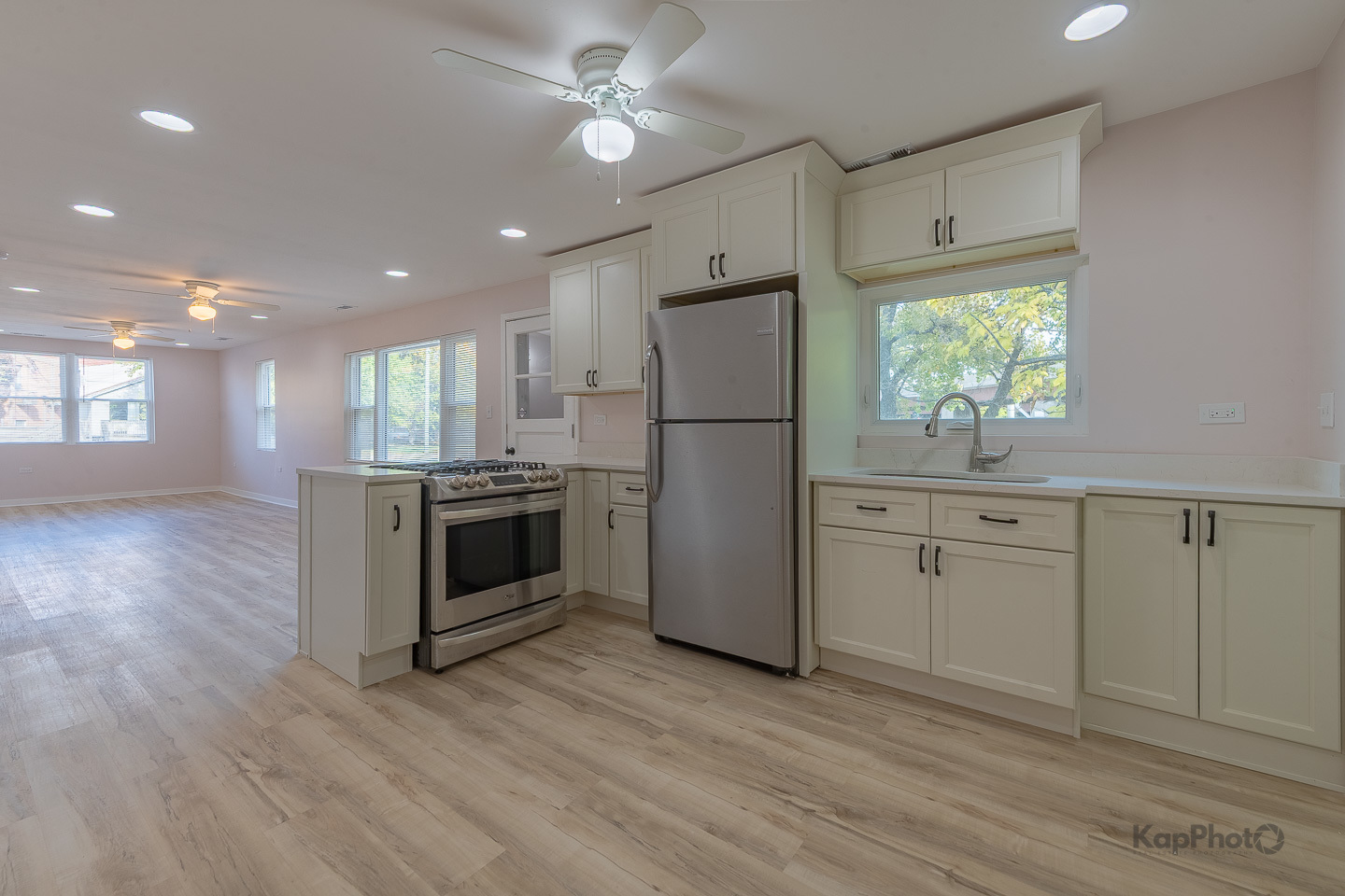 2029 South Canalport Avenue, Unit 2 Chicago, IL 60616 - Photo 8 of 28 a kitchen with white cabinets and white appliances