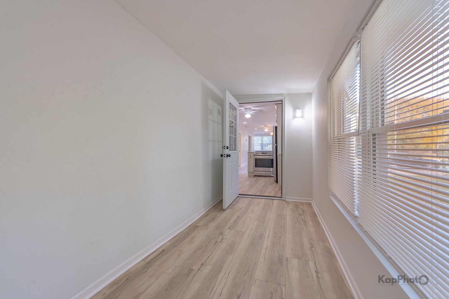2029 South Canalport Avenue, Unit 2 Chicago, IL 60616 - Photo 10 of 28 a view of hallway with a large window and wooden floor
