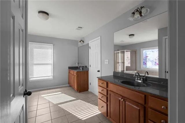 a bathroom with a bathtub and a shower