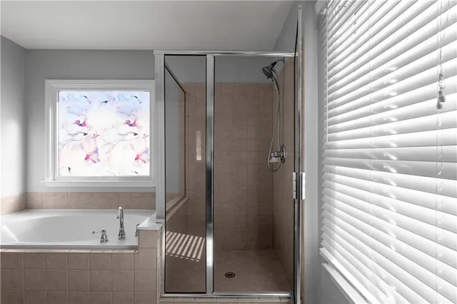 a bathroom with a sink a mirror and a shower