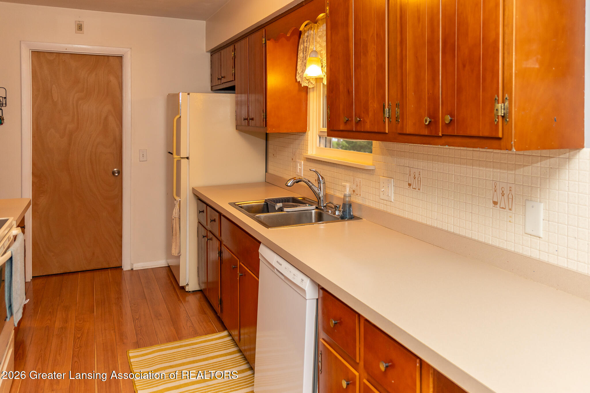 3720 Dell Road Holt, MI 48842 - Photo 12 of 47 Kitchen/ Entrance to Family Room