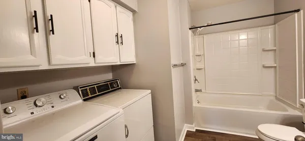 a bathroom with a bathtub and a sink