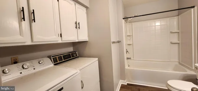a bathroom with a bathtub and a sink