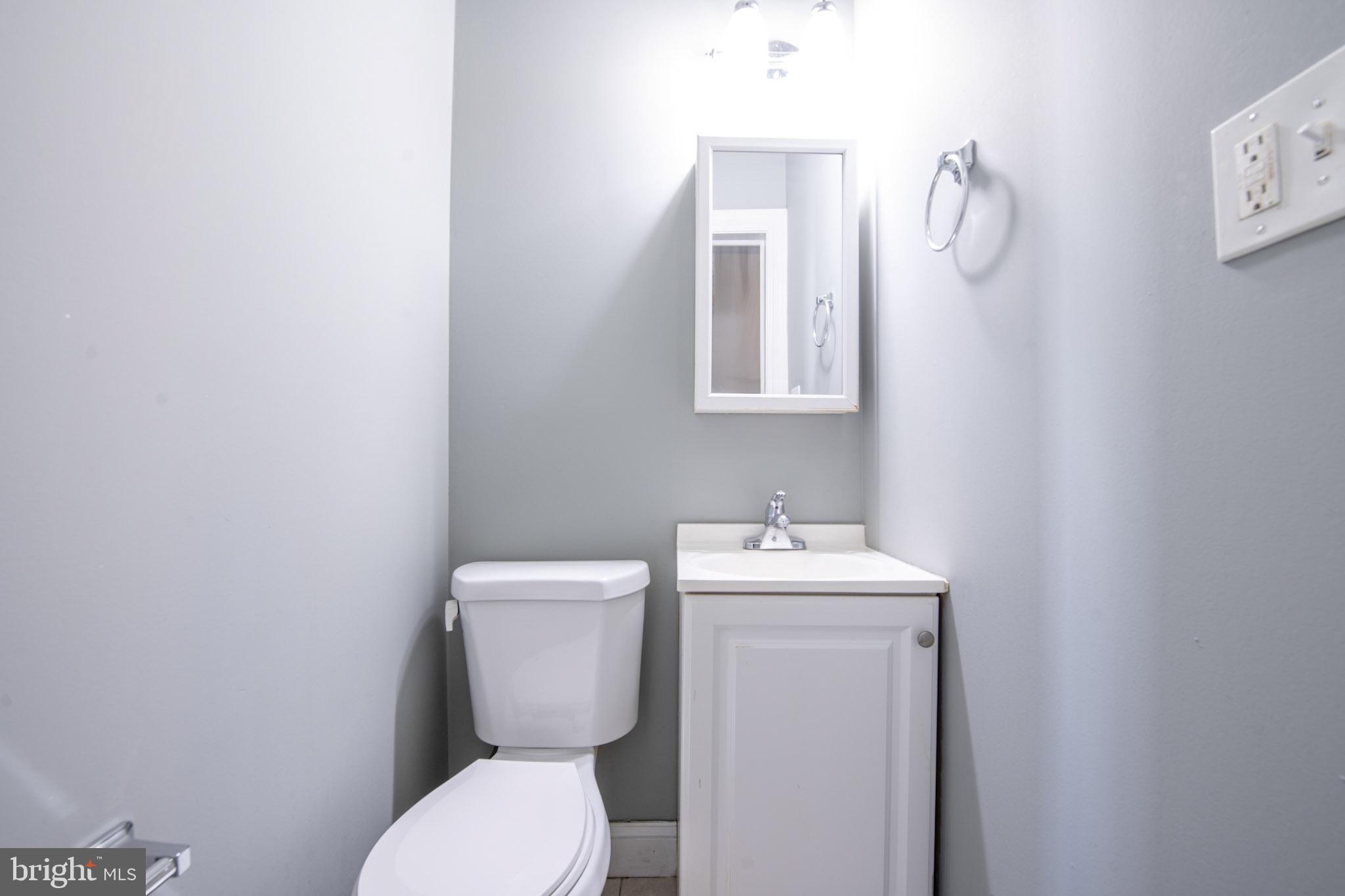 131 Bridgeboro Street Riverside, NJ 08075 - Photo 16 of 21 a bathroom with a toilet sink and mirror