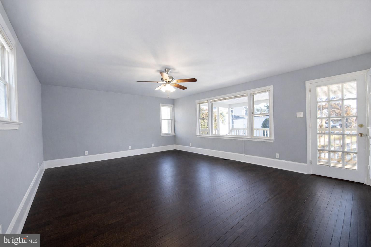 131 Bridgeboro Street Riverside, NJ 08075 - Photo 6 of 21 a view of an empty room with wooden floor and a window