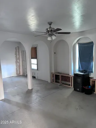 a kitchen with a sink a refrigerator and cabinets