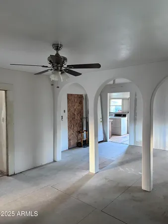 a kitchen with a sink a refrigerator and window
