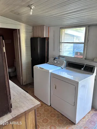 a view of a kitchen with a sink and dishwasher cabinets