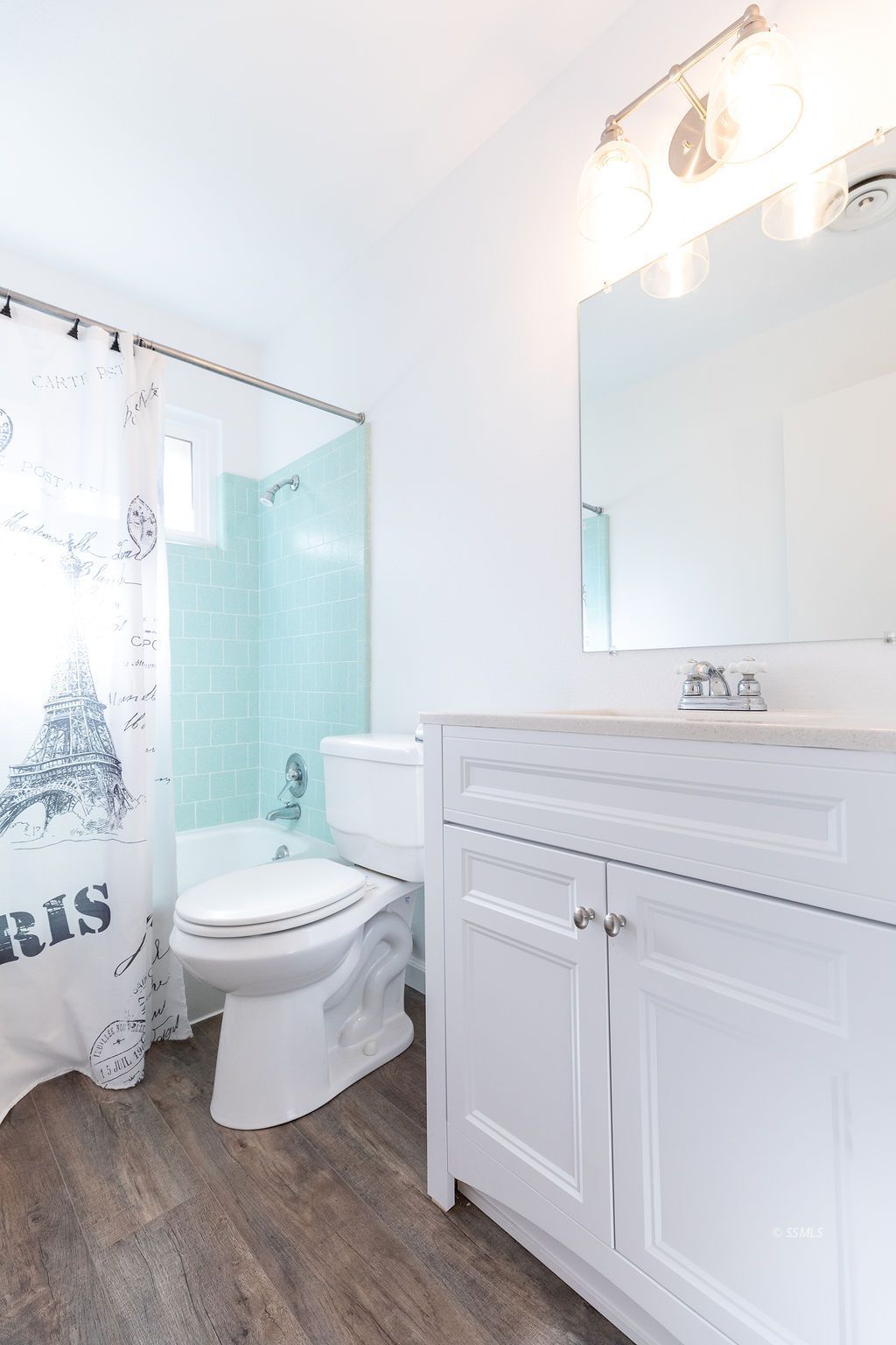 725 Randall Street Ridgecrest, CA 93555 - Photo 25 of 36 a bathroom with a white toilet sitting next to a bathroom sink and a shower