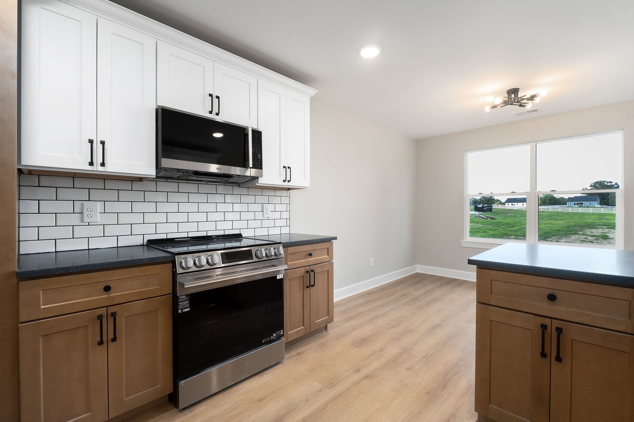 3535 Keltonburg Road Smithville, TN 37166 - Photo 14 of 37 a kitchen with a stove and a microwave