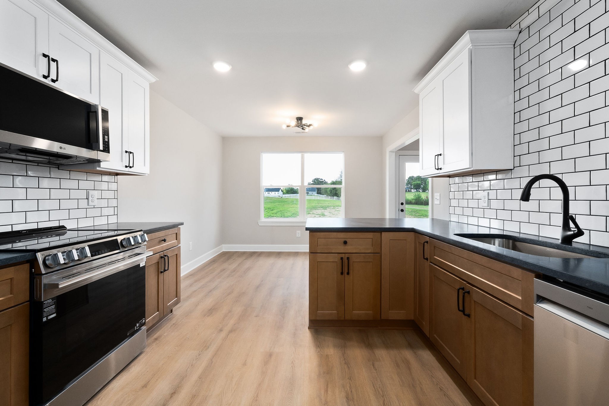 3535 Keltonburg Road Smithville, TN 37166 - Photo 15 of 37 a kitchen with a sink stove and microwave