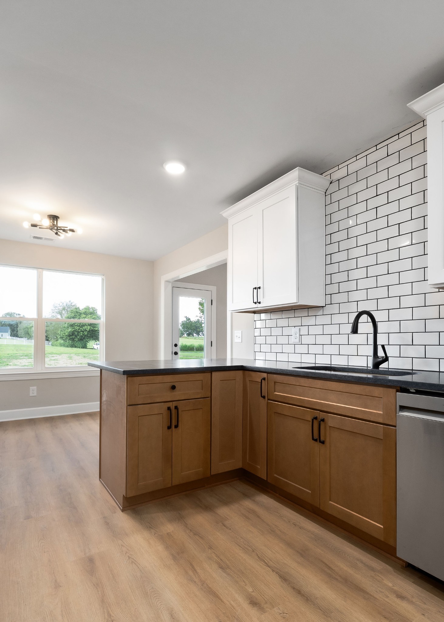 3535 Keltonburg Road Smithville, TN 37166 - Photo 16 of 37 a kitchen with stainless steel appliances granite countertop a sink and cabinets