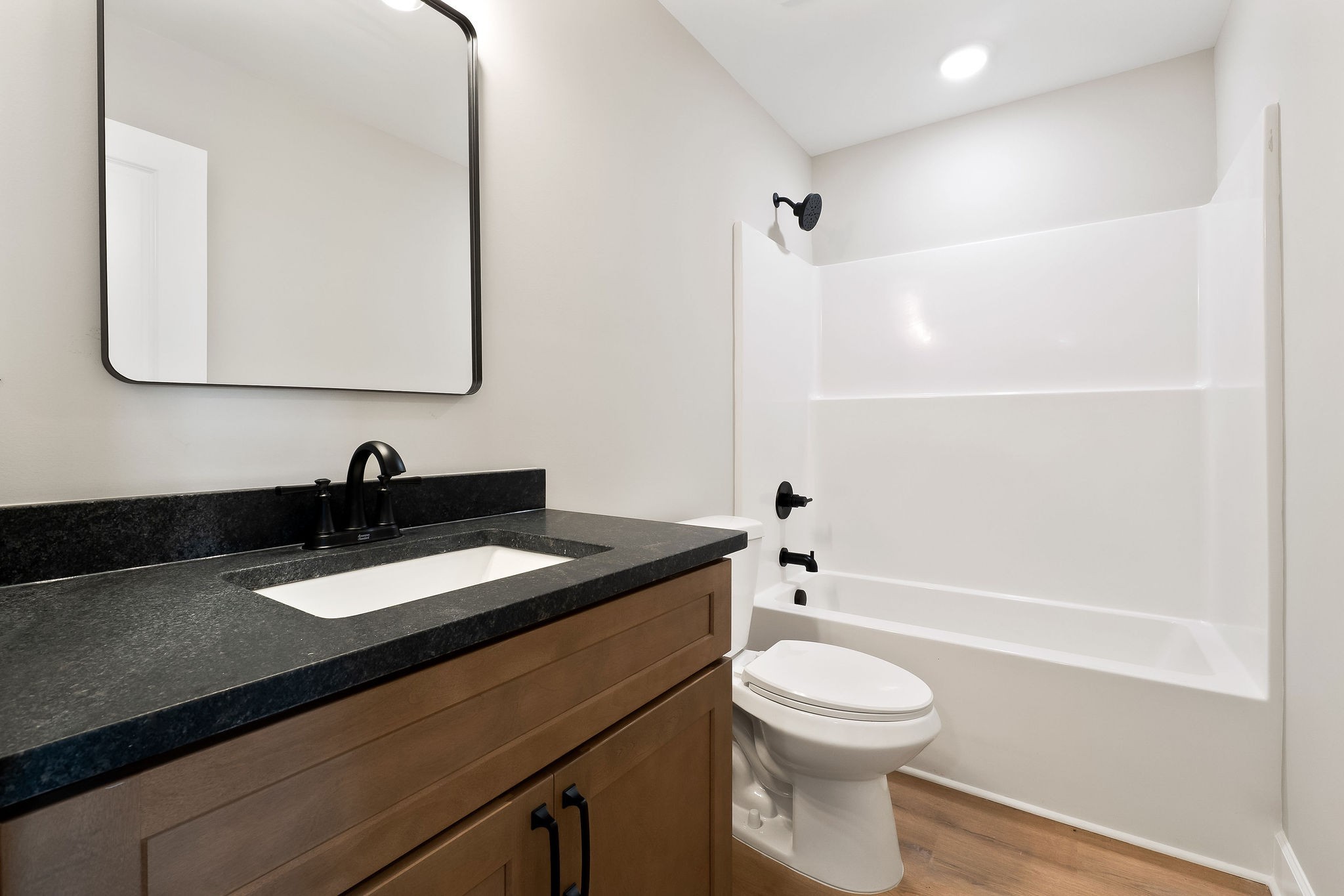 3535 Keltonburg Road Smithville, TN 37166 - Photo 21 of 37 a bathroom with a granite countertop sink toilet a large mirror and shower