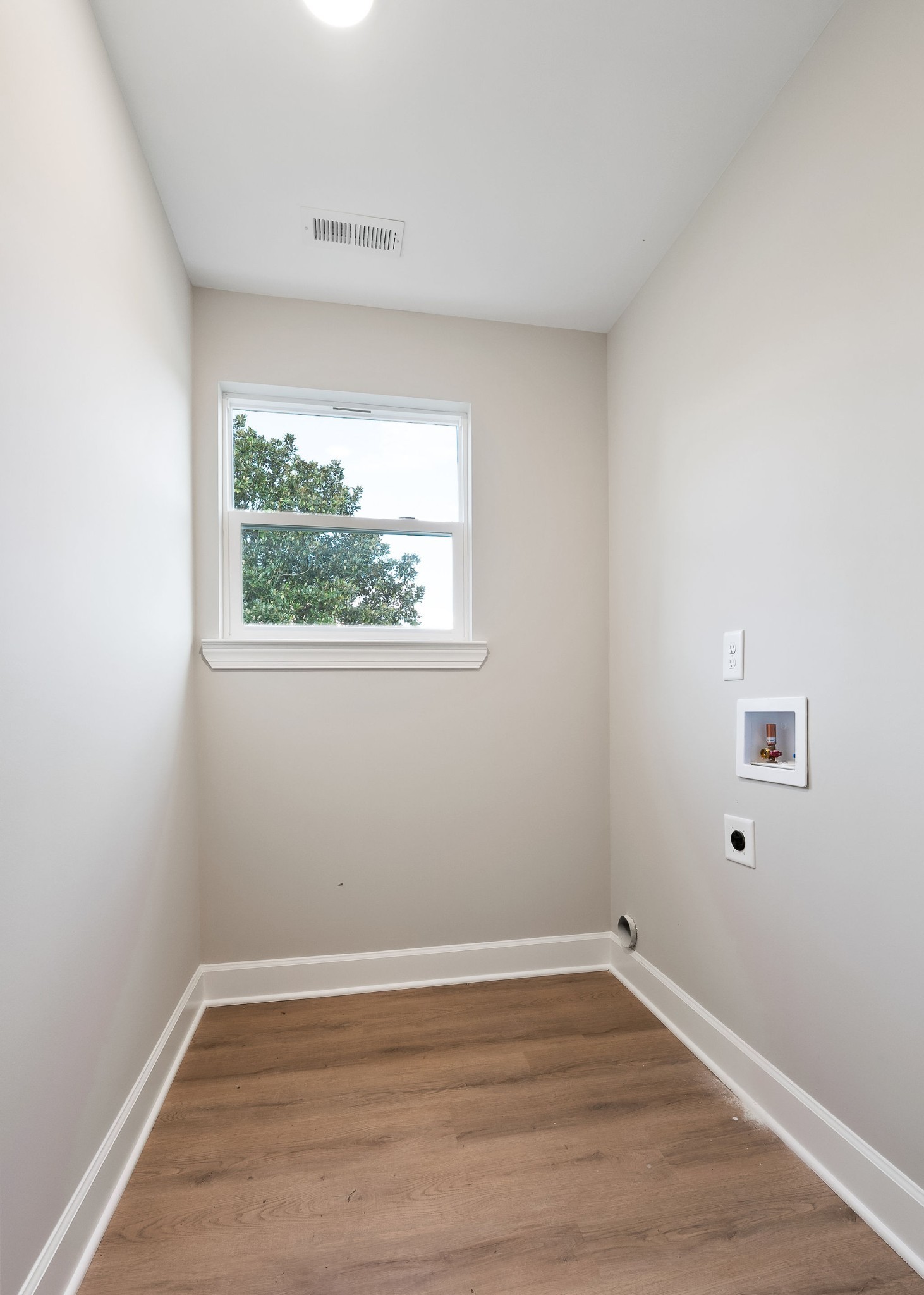 3535 Keltonburg Road Smithville, TN 37166 - Photo 22 of 37 a view of an empty room with wooden floor and a window