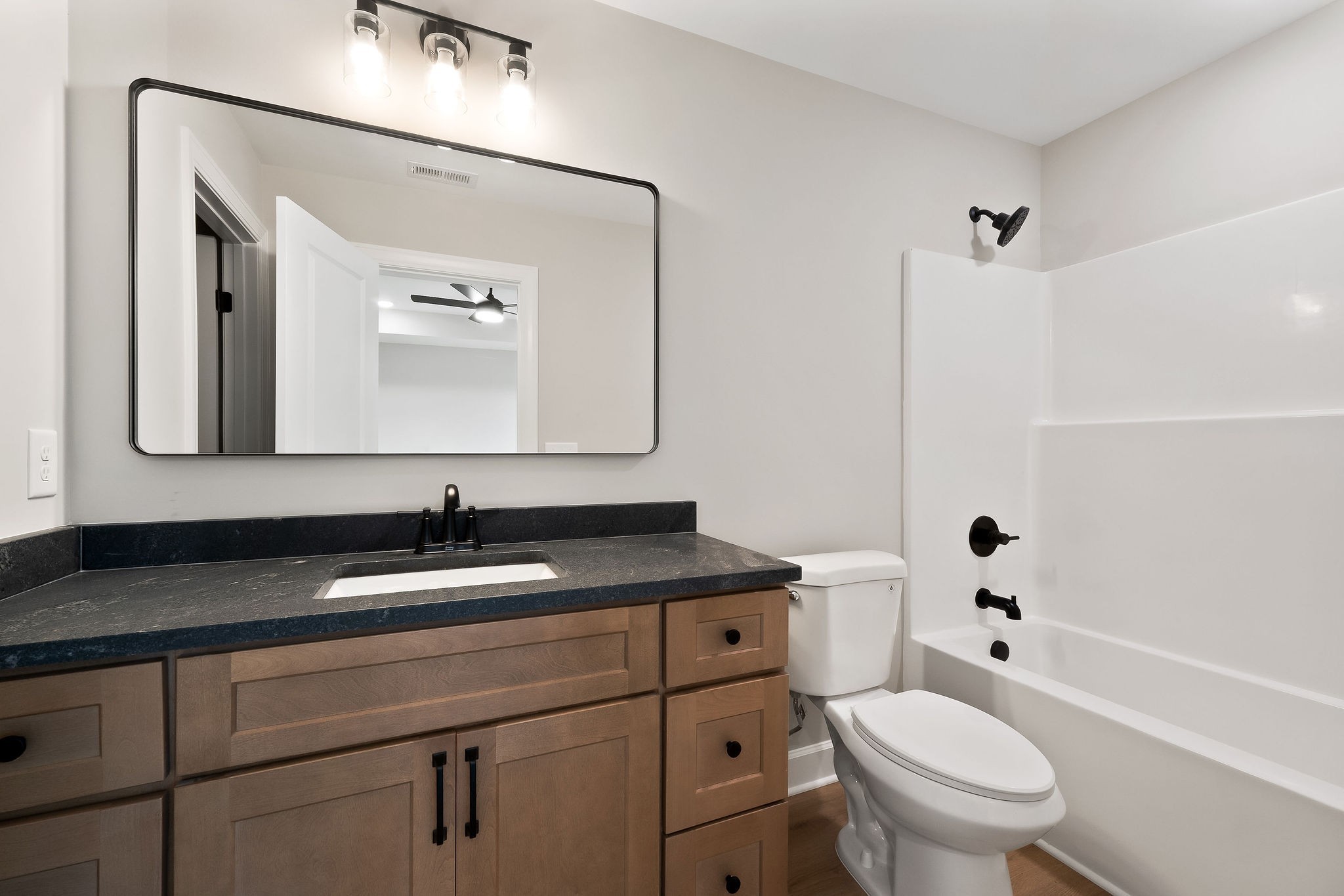 3535 Keltonburg Road Smithville, TN 37166 - Photo 26 of 37 a bathroom with a granite countertop toilet sink and mirror