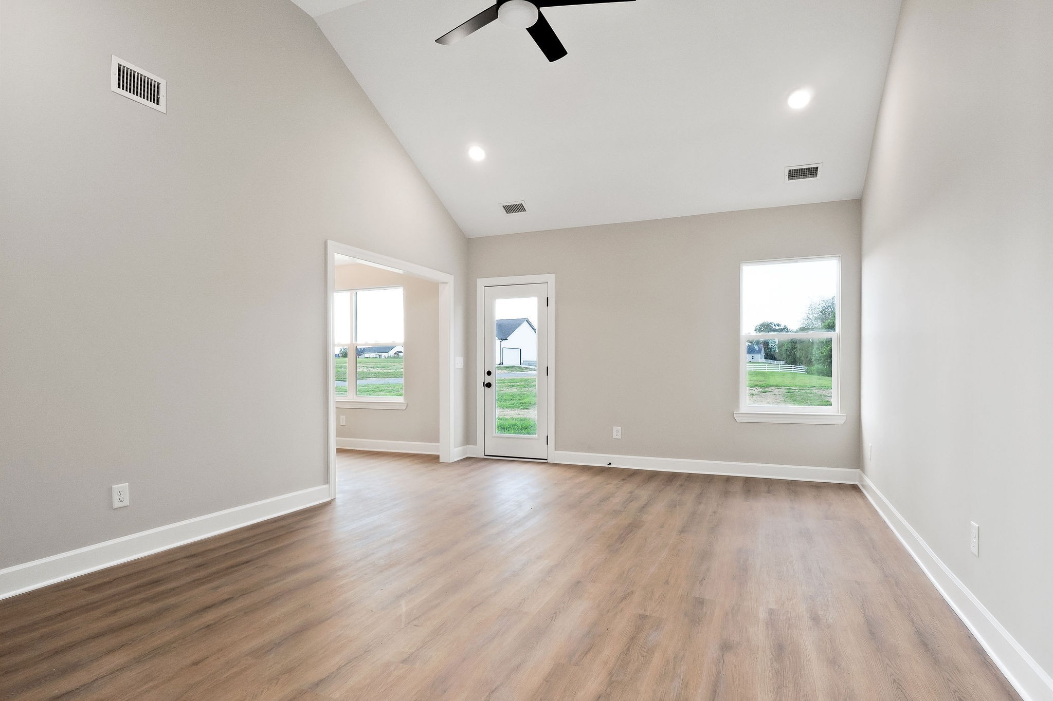 3535 Keltonburg Road Smithville, TN 37166 - Photo 4 of 37 an empty room with wooden floor and windows