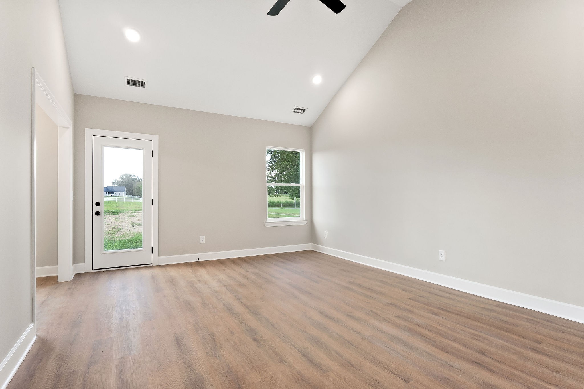 3535 Keltonburg Road Smithville, TN 37166 - Photo 5 of 37 an empty room with wooden floor and windows