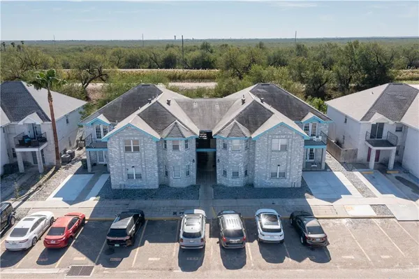 an aerial view of a house with swimming pool