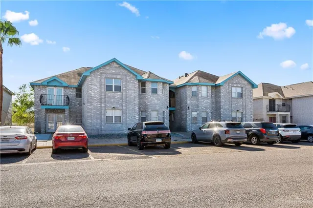 a view of a car parked in front of a house