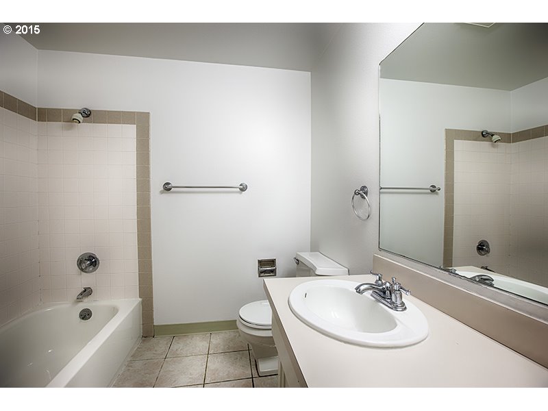 31 Southwest Taylors Ferry Road Portland, OR 97219 - Photo 11 of 23 a bathroom with a sink a toilet and shower