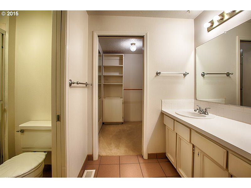 31 Southwest Taylors Ferry Road Portland, OR 97219 - Photo 15 of 23 a bathroom with a sink a toilet and shower