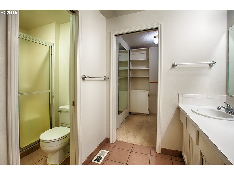 31 Southwest Taylors Ferry Road Portland, OR 97219 - Photo 16 of 23 a bathroom with a sink a toilet and shower