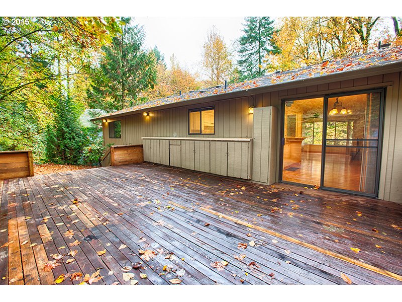 31 Southwest Taylors Ferry Road Portland, OR 97219 - Photo 20 of 23 a view of a house with a yard