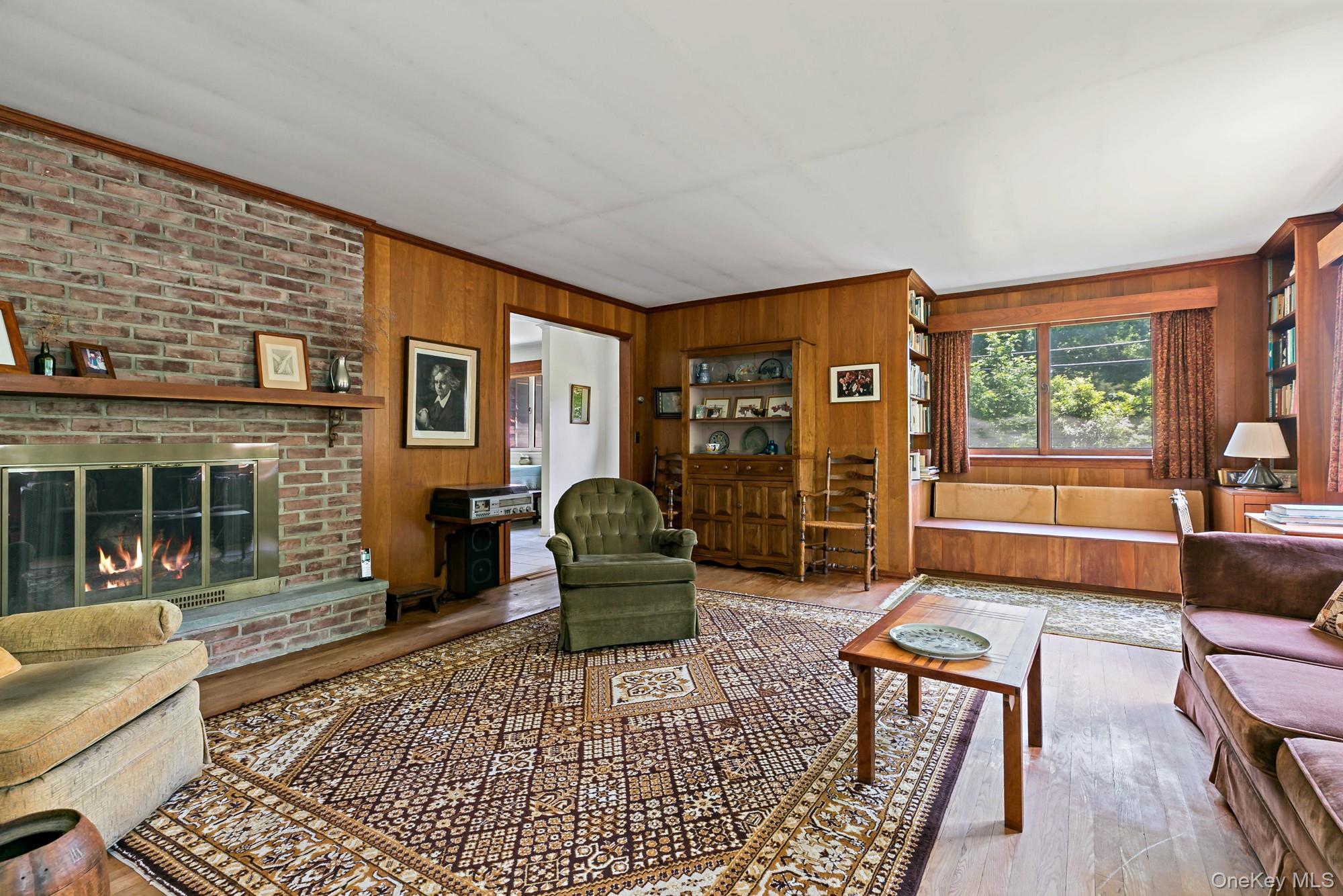 538 Croton Heights Road Yorktown Heights, NY 10598 - Photo 5 of 24 Massive brick fireplace with views of the custom cabinetry.