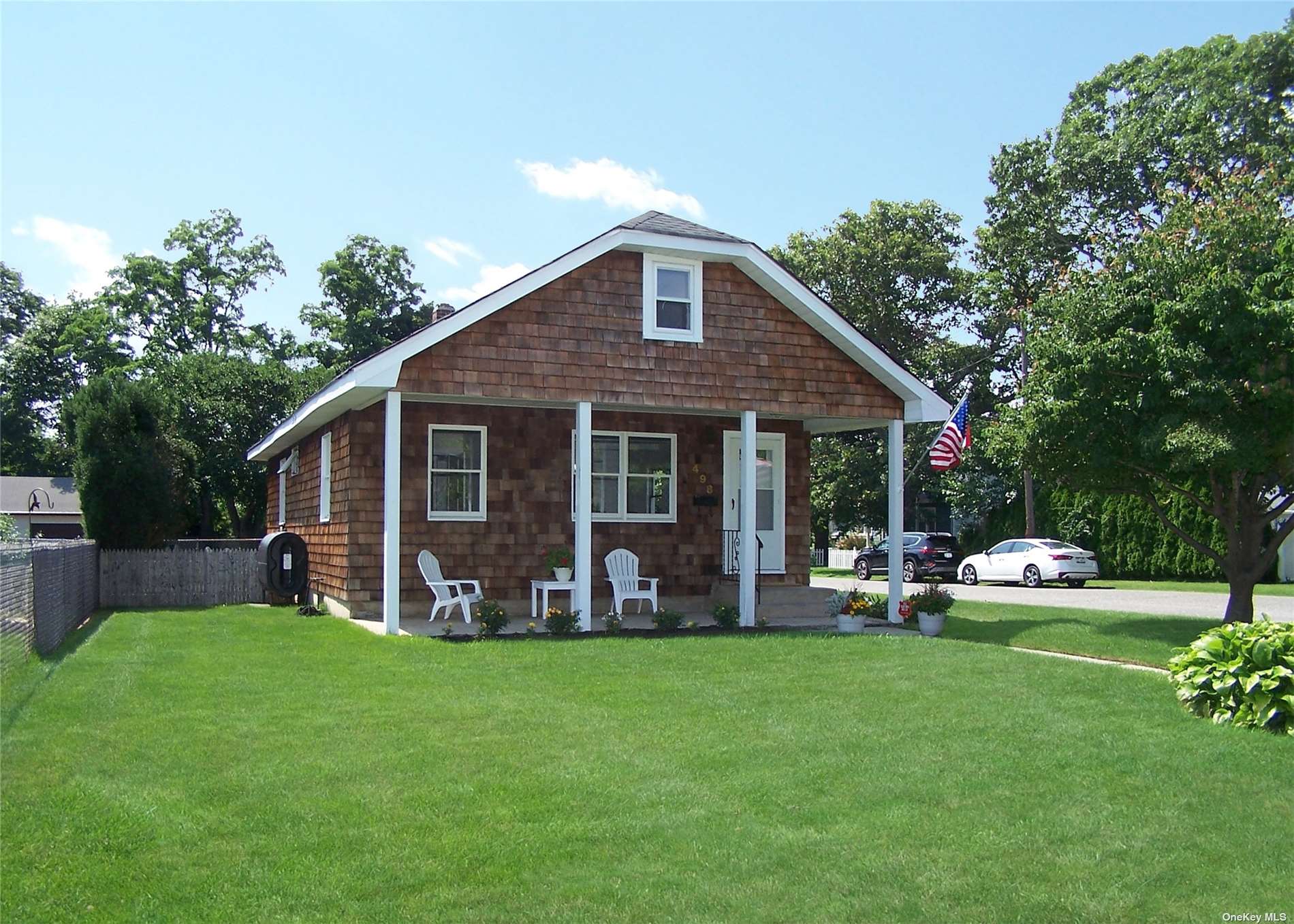 a front view of house with yard and patio