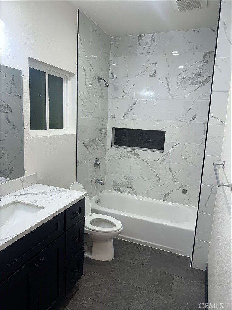 10627 1/2 Garvey Avenue, Unit 6 El Monte, CA 91733 - Photo 2 of 8 a bathroom with a sink a toilet and shower