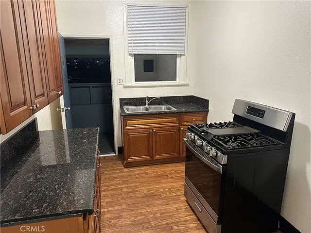 a kitchen with a stove and a microwave