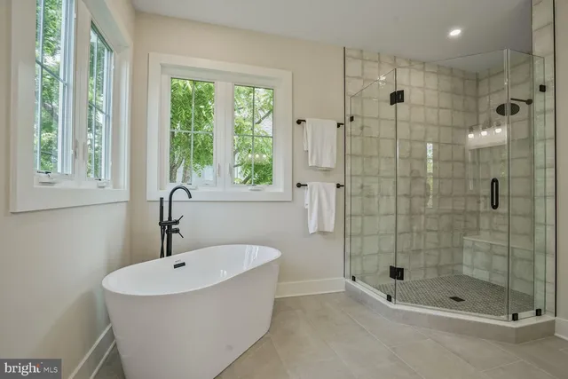 a bathroom with a shower and a sink