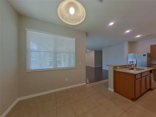 a kitchen with stainless steel appliances granite countertop a stove and a sink
