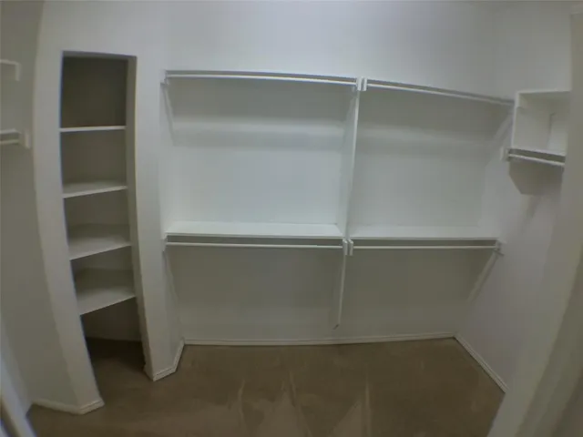 a view of an empty walk in closet