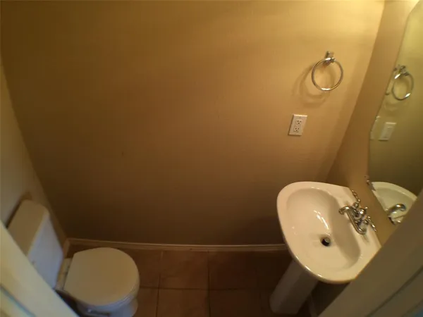 a bathroom with a toilet and sink