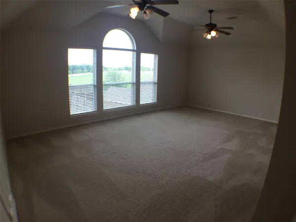 an empty room with a empty space and a window