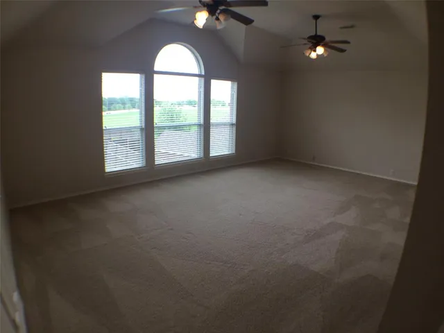 an empty room with a empty space and a window