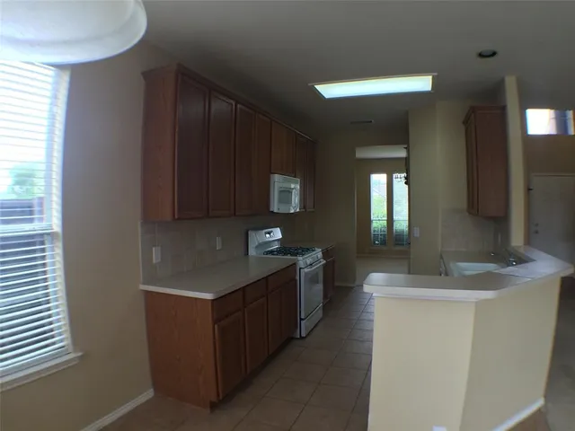 a kitchen with a sink and a cabinets