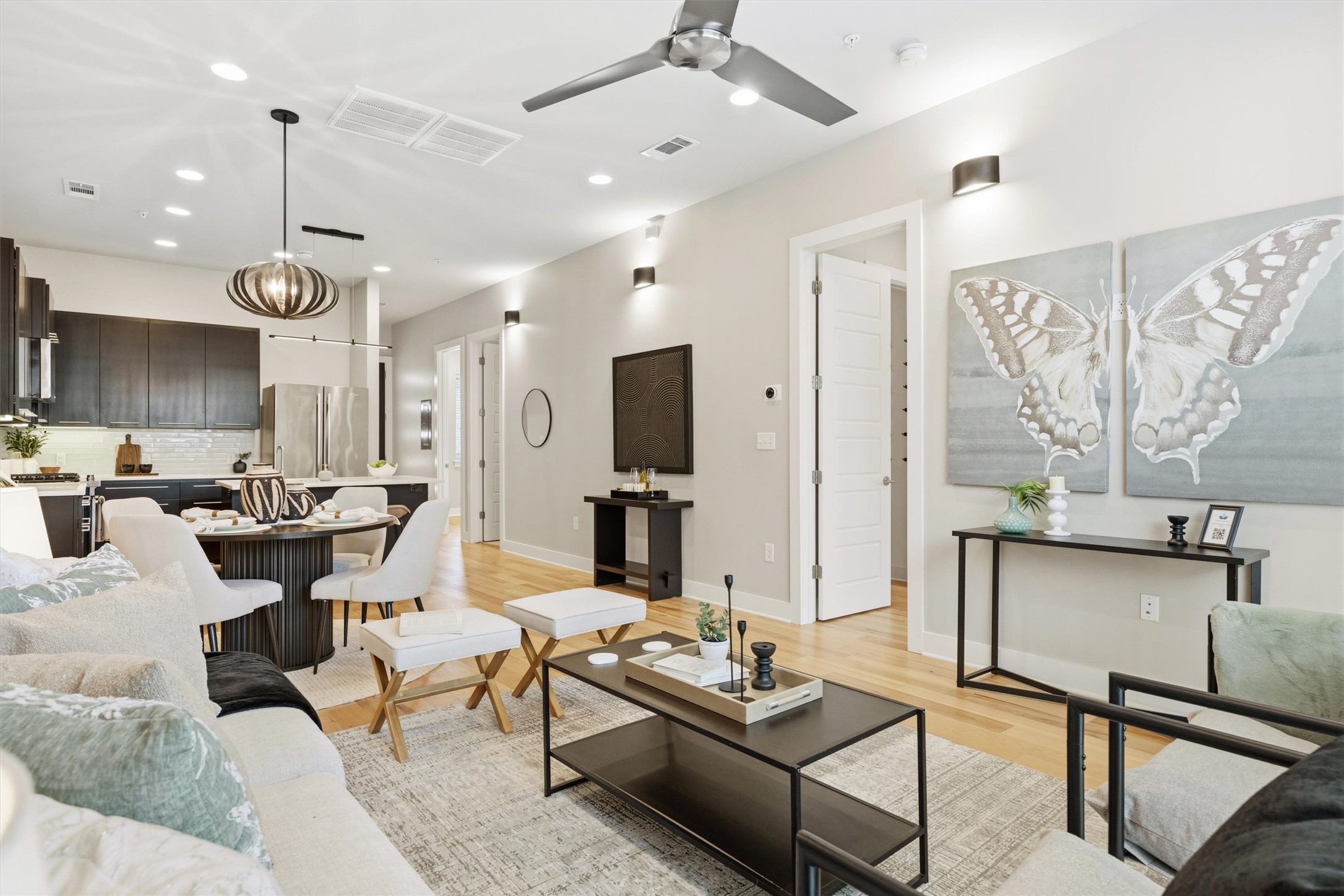 2314 Enfield Road, Unit 203 Austin, TX 78703 - Photo 36 of 37 The open floor plan connects living, dining, and kitchen in one fluid, airy space.