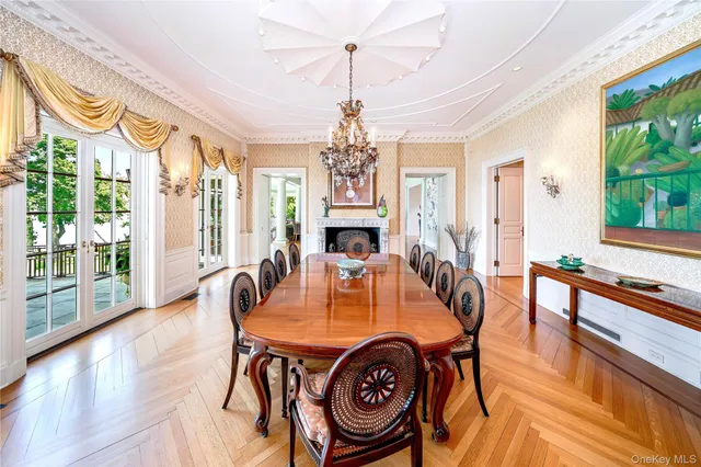 a living room with lots of furniture and a chandelier