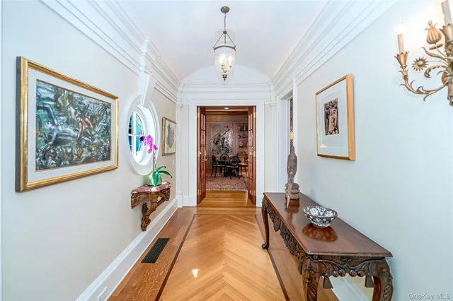 a kitchen with stainless steel appliances granite countertop a sink and wooden floor